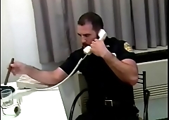 Manly cop fucks a horny gay stud in his office